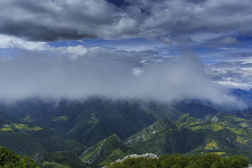 Beautiful mountain scenery in the Alps in summer and clouds