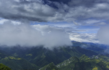 Beautiful mountain scenery in the Alps in summer and clouds