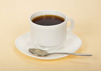 Coffee in cup with saucer