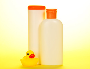 Rubber duckling and set of children's cosmetics