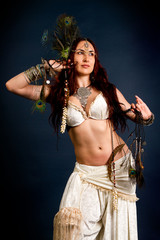 Young attractive retro model in old-fashioned wild clothing danc