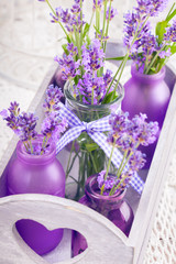 Obraz na płótnie Canvas Lavender in bottles decor
