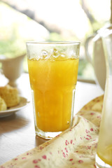 close up orange juice in big glass