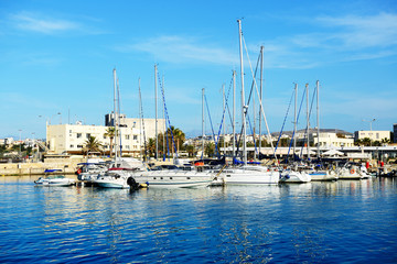 Obraz premium The yachts and motor boats are near pier, Crete, Greece