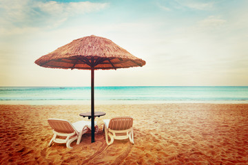 Tropical beach view. Two beach chairs.