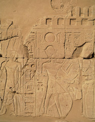 Egyptian images and hieroglyphs engraved on stone