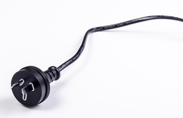 A black Australian power cord plug on white background