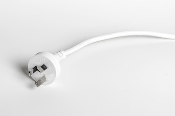 A white Australian power cord plug on white background