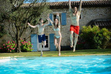 group friends jumping resorts swimming pool summer holidays