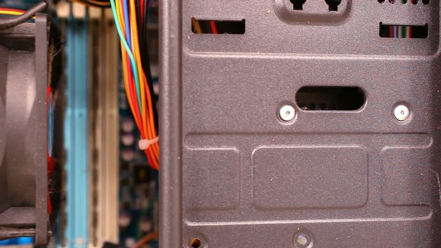 Close up of electronic board with components. Computer inside.
