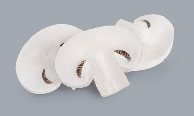Three mushroom slices isolated on grey background 2