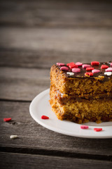 cake with hearts on wooden background