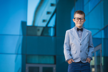 kid businessman on the blue modern background