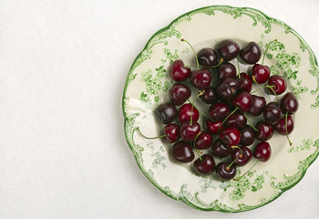 Plate with fresh cherry