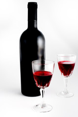 Wine glass and wine bottle still life isolated