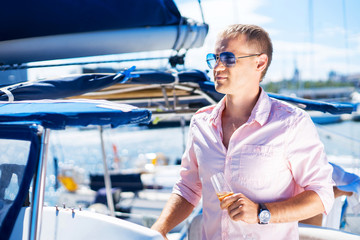 Handsome blond man relaxing on a vacation on a boat