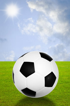 Football with field and sky background