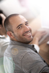 Fototapeta premium Smiling guy in business training attending meeting