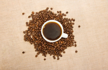 Fototapeta na wymiar Cup of coffee and grains