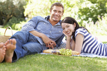 Couple in park with picnic