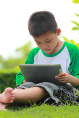 Boy using digital tablet