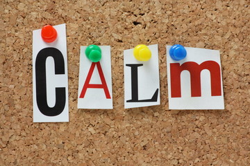 The word Calm on a cork notice board