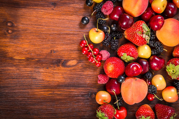 fresh berries on wooden table