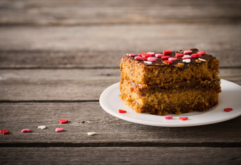 cake with hearts on wooden background