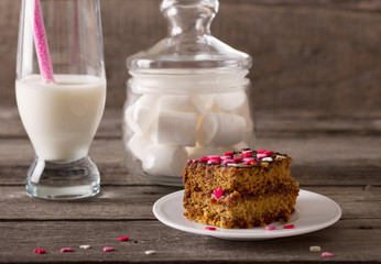 cake with hearts on wooden background