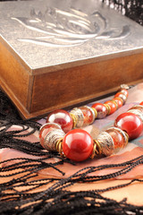 Silver box and red necklace closeup