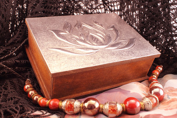 Silver box and red necklace