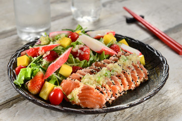 Salad with salmon sashimi
