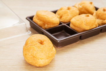 Cream puffs and plastic box