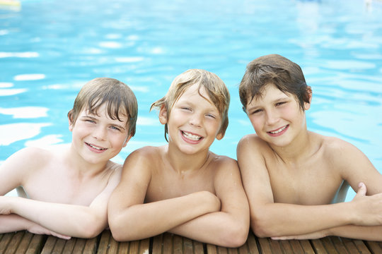 Boys in outdoor swimming pool