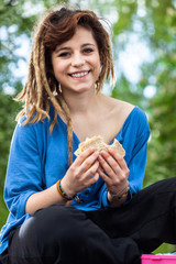 Teen girl with sandwich