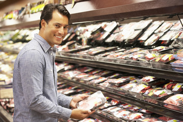 Man shopping in supermarket