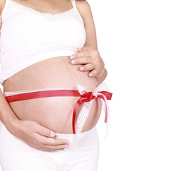 Belly of a pregnant woman and  ribbon with clipping paths