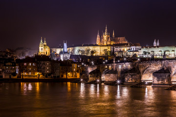 Obraz na płótnie Canvas The View on Prague gothic Castle with Charles Bridge