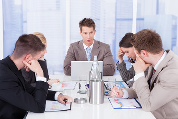 Tired Business People In Conference Meeting