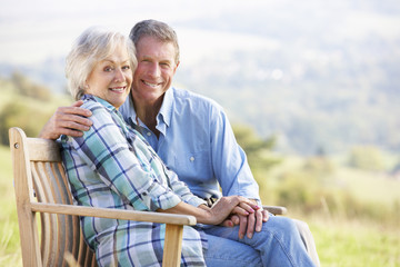 Senior couple sitting outdoors