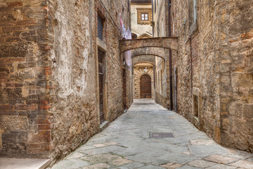 ancient alley in Volterra, Tuscany, Italy - obrazy, fototapety, plakaty
