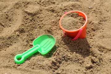 Colorful toys for children's sandboxes on the sea beach