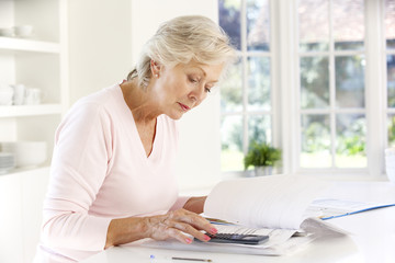 Retired woman with household bills