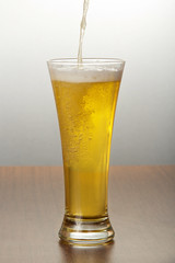 Beer pouring into glass