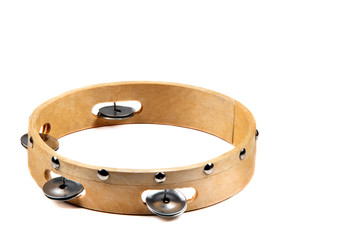 Isolated wooden tambourine with bell on white background
