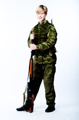 young man in camouflage with a sniper rifle