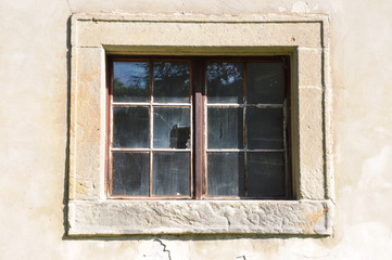 Broken glass in stone window