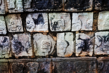 Shaped stones on wall of Chichen Itza monument