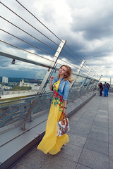 Girl Blondinka standing on the roof