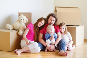 Fototapeta premium Happy young family in their new home